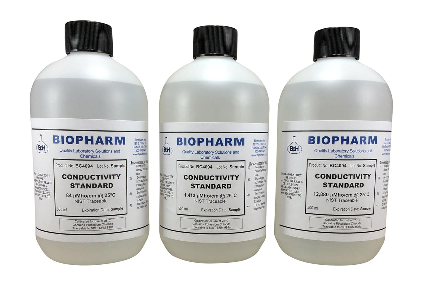 Three bottles of Biopharm conductivity standard solution on a white background